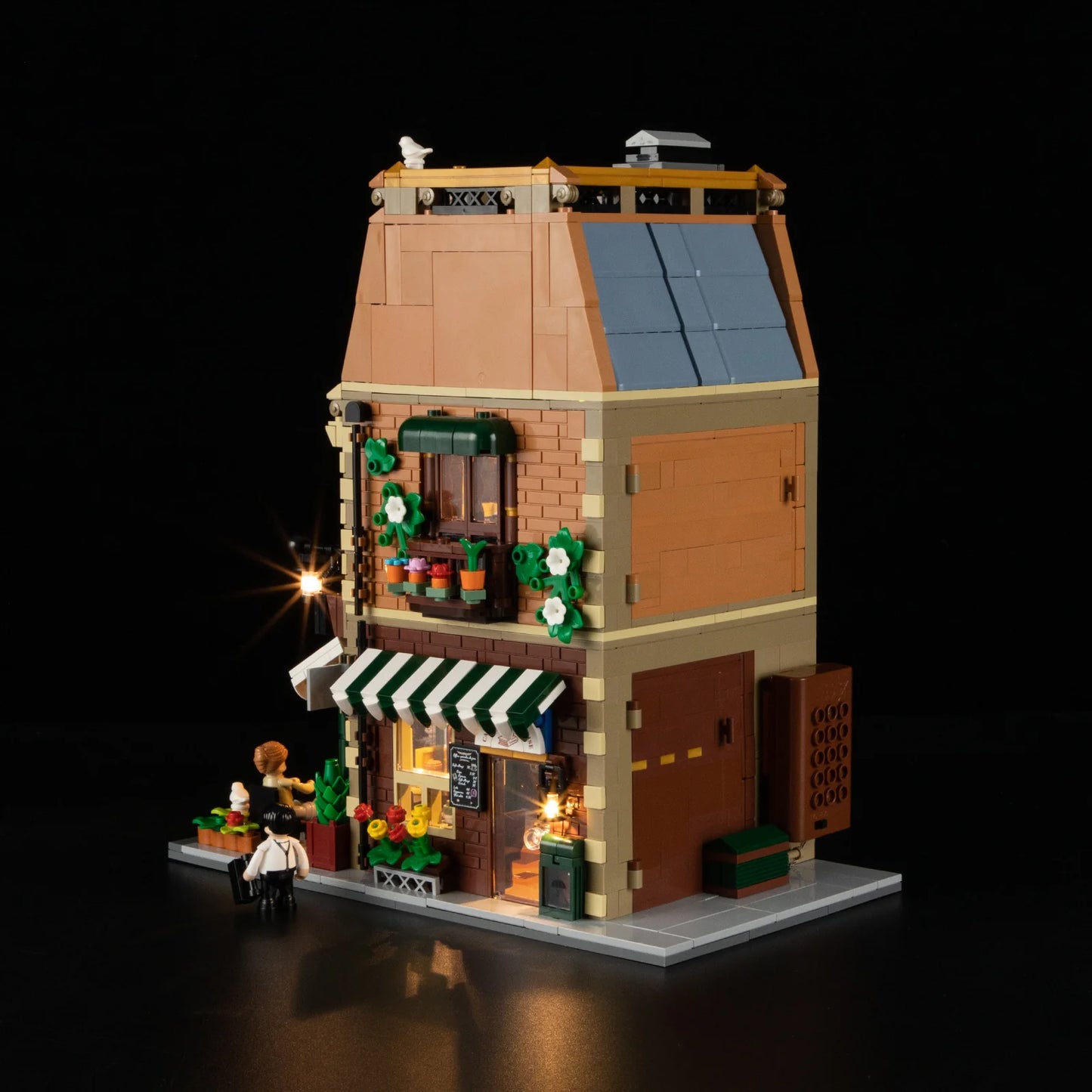 Back view of Funwhole Book Cafe building set with LED lights, featuring Parisian architecture, bookstore, and cozy cafe details.
