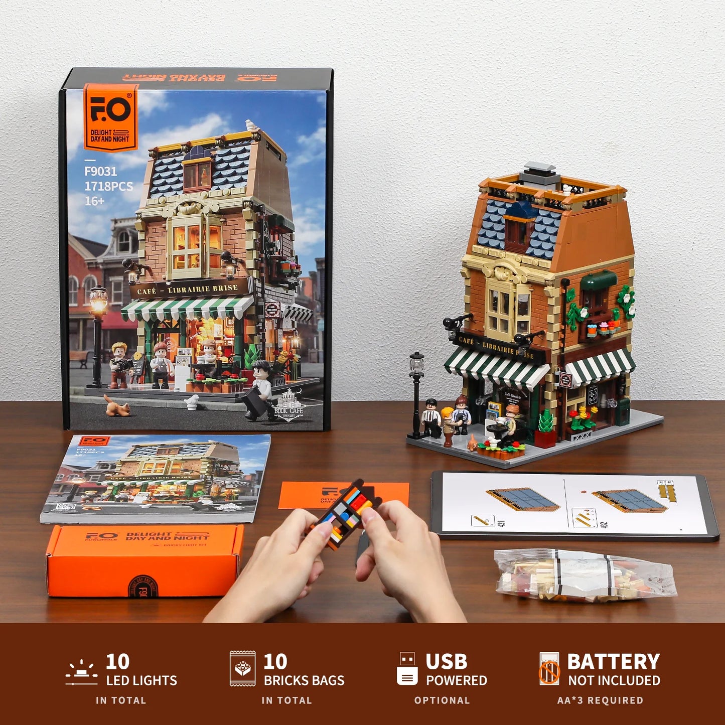 Funwhole Book Cafe modular building set unboxed, showcasing assembly instructions, LED lights, and included brick bags.