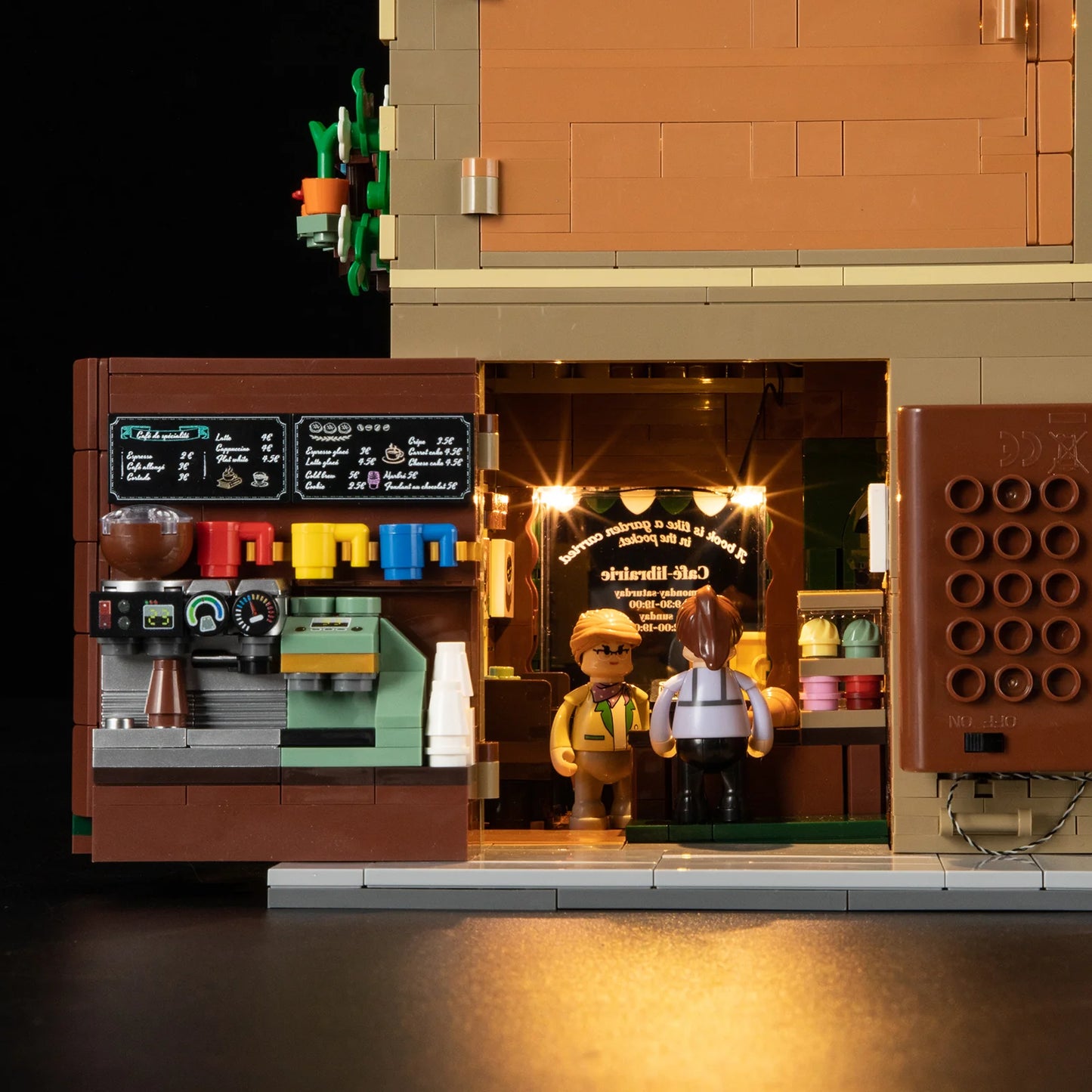 Close-up of Funwhole Book Cafe coffee counter with LED lights, detailed espresso machine, menu board, and mini-figures.