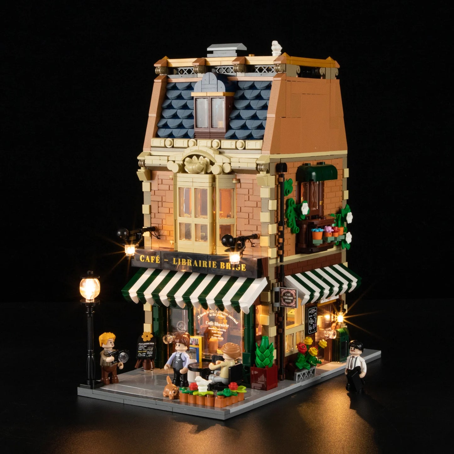 Funwhole Book Cafe building set with warm LED lights, Parisian-style bookstore, coffee shop, and detailed mini-figure scene.
