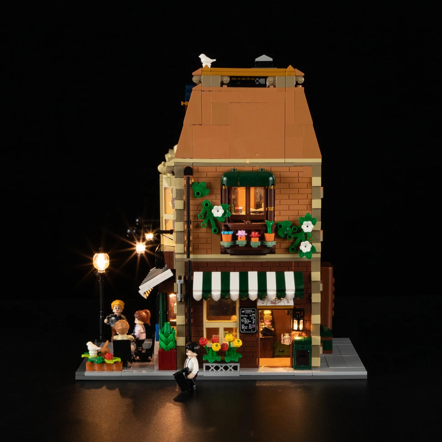Side view of Funwhole Book Cafe building set with LED lights, Parisian architecture, bookstore, coffee shop, and mini-figures.