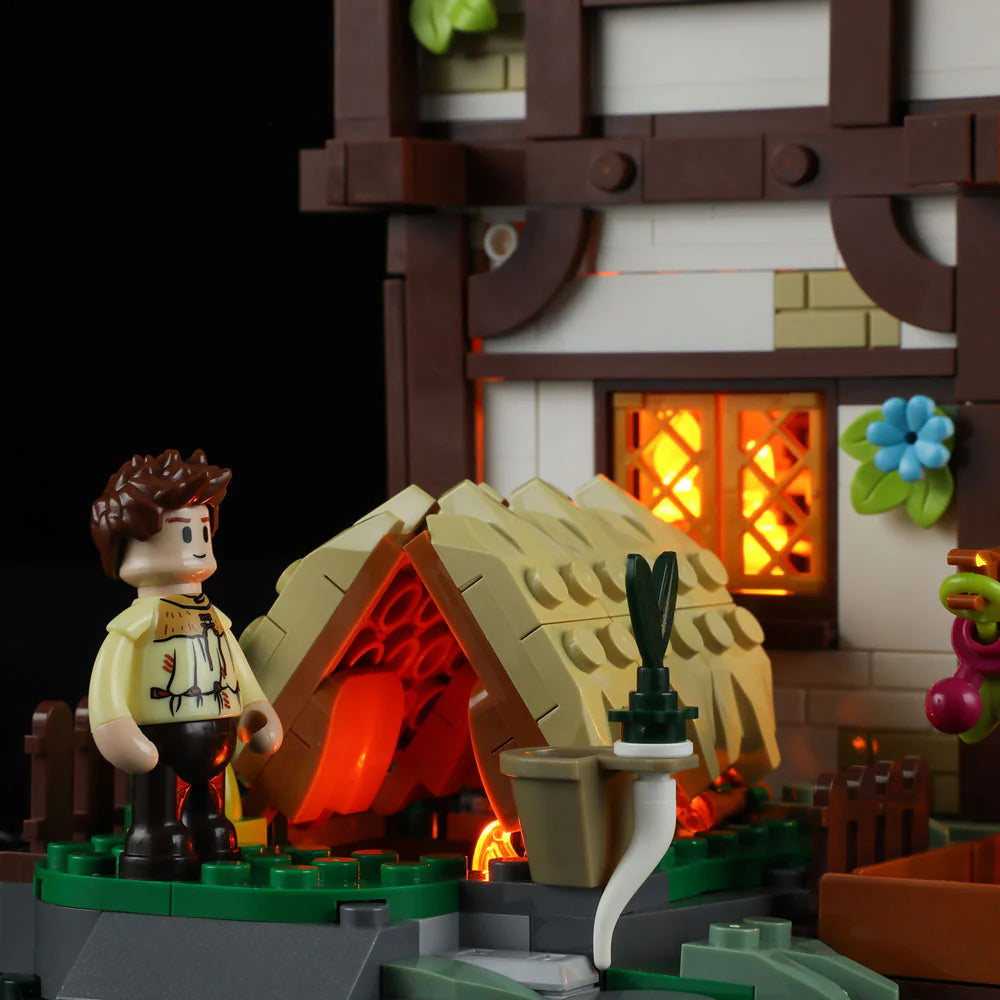 Funwhole Medieval Apothecary Shop – Herbalist minifigure near a glowing thatched hut with magical plants and potion ingredients