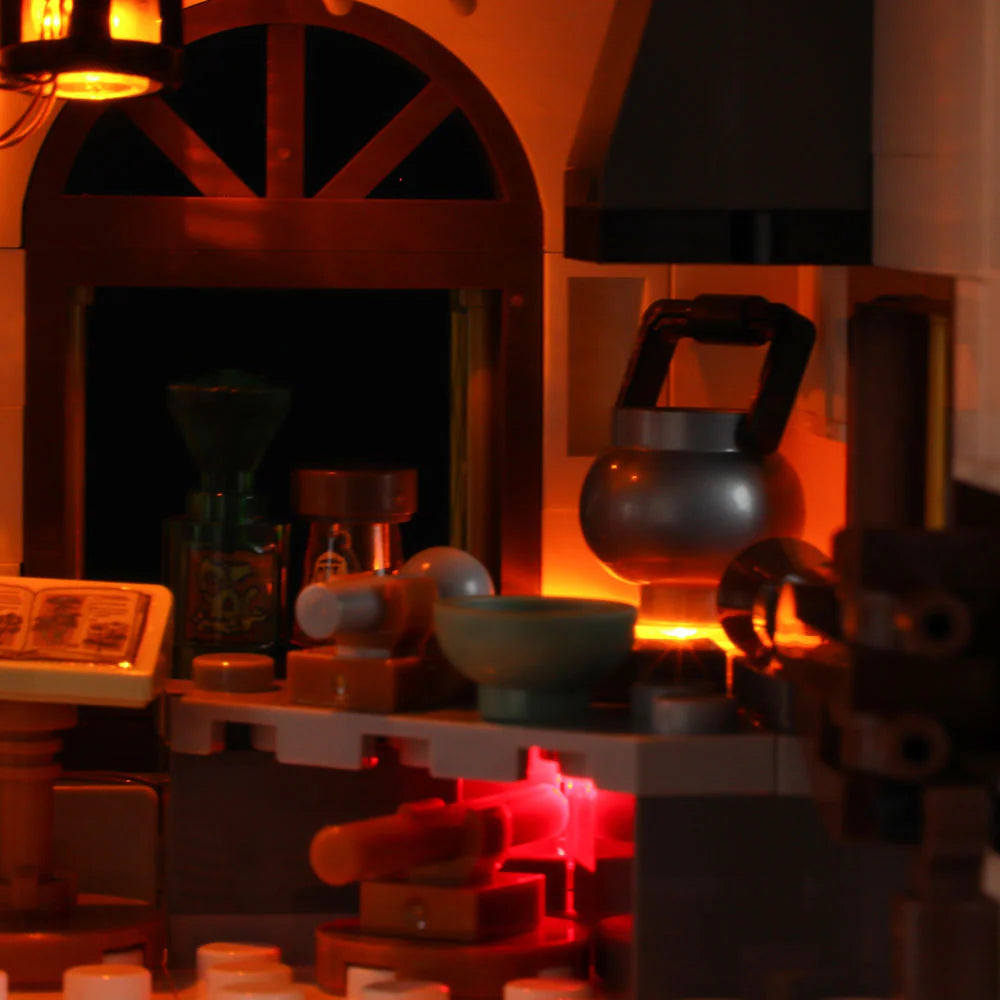 Funwhole Medieval Apothecary Shop Set – Detailed potion brewing area with glowing fireplace, cauldron, and alchemy tools