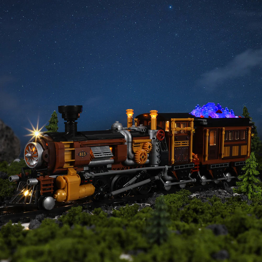 Lumibricks F9006 Steampunk Ore Train at night on forest tracks with glowing LED headlights and illuminated blue ore crystals
