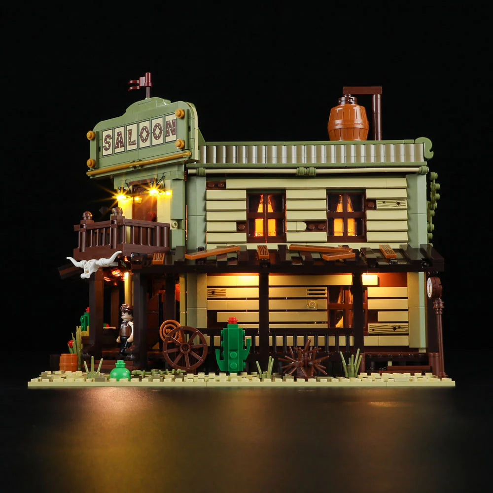 Lumibricks F9021 Western Saloon side facade with LED-lit windows, wagon wheels, wooden porch, and classic Western decor