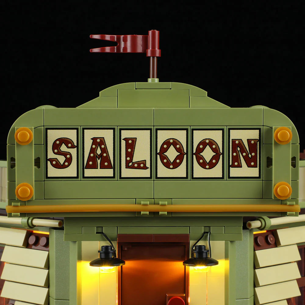 Lumibricks F9021 Western Saloon close-up of illuminated saloon sign with vintage lettering and red flag on green facade