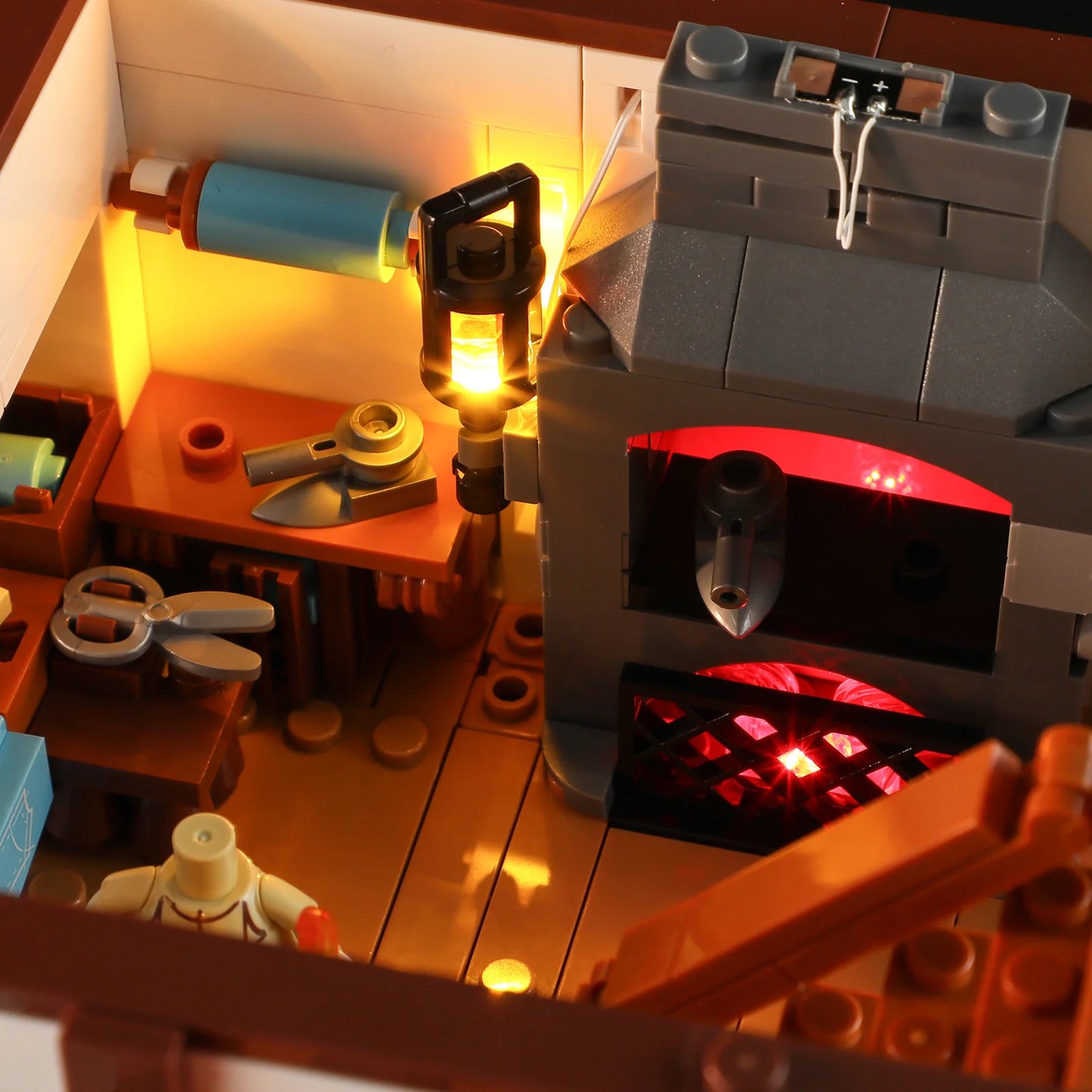 Lumibricks F9038 Medieval Tailor Shop workshop detail with glowing fireplace, sewing tools, and illuminated lantern