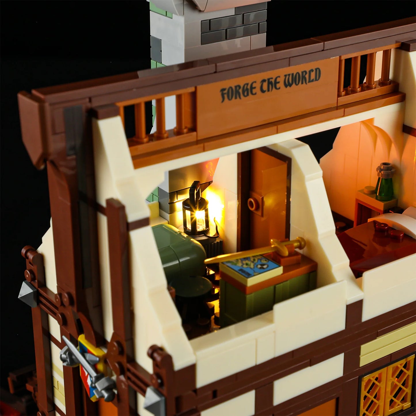 Lumibricks F9040 Forge House bedroom with glowing lantern, map table, green bench, and “Forge the World” sign above