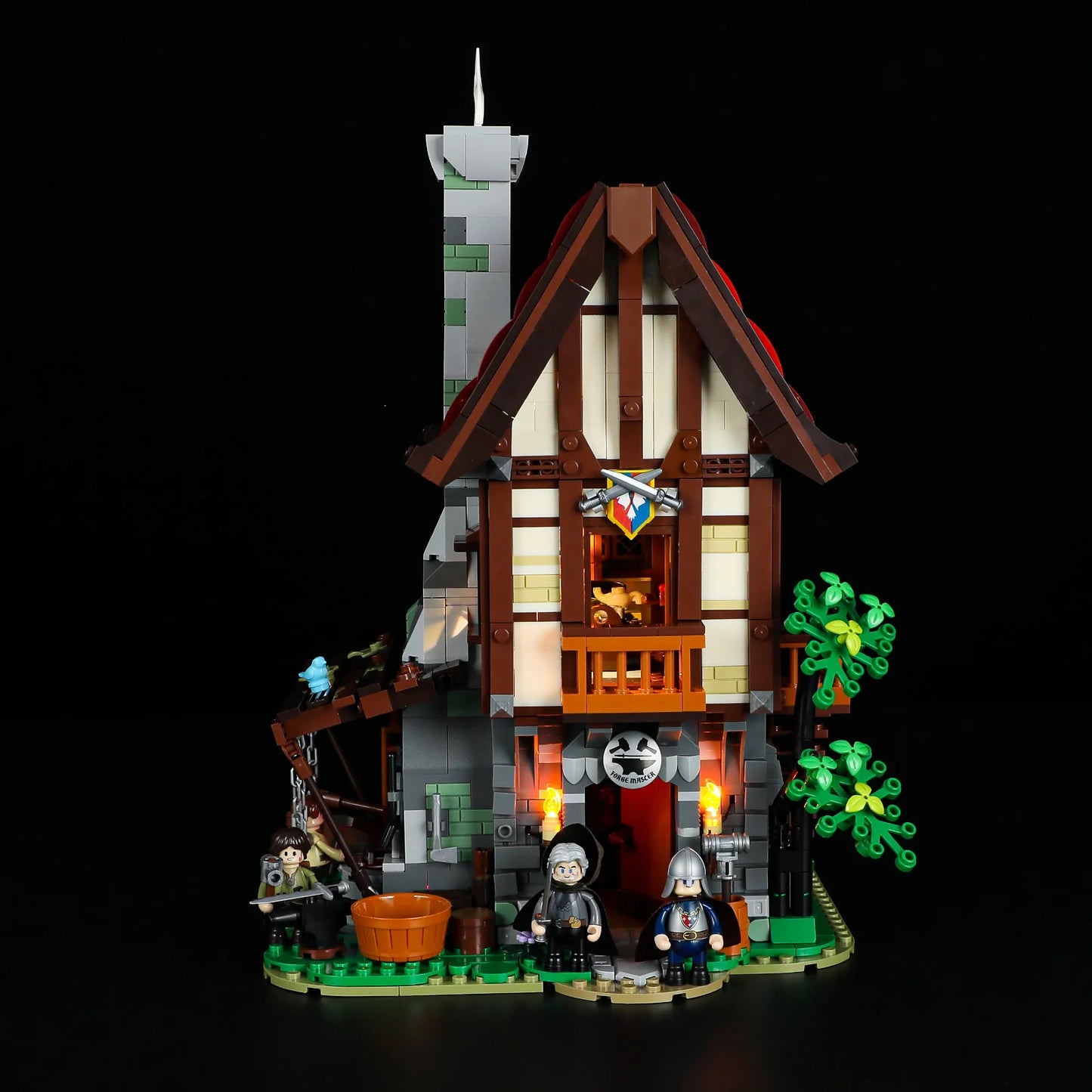 Lumibricks F9040 Forge House front view with illuminated entry, balcony, minifigures, and medieval blacksmith details