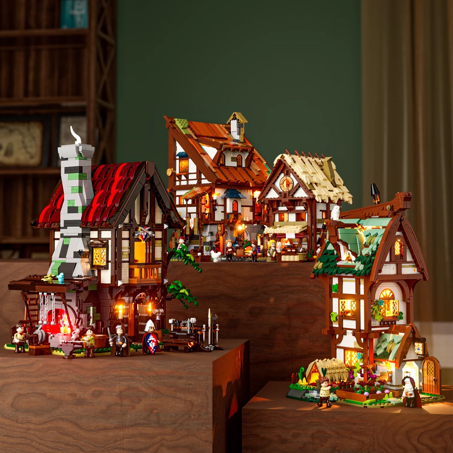 Lumibricks F9040 Forge House displayed with other medieval village modular sets, all illuminated with minifigures and accessories