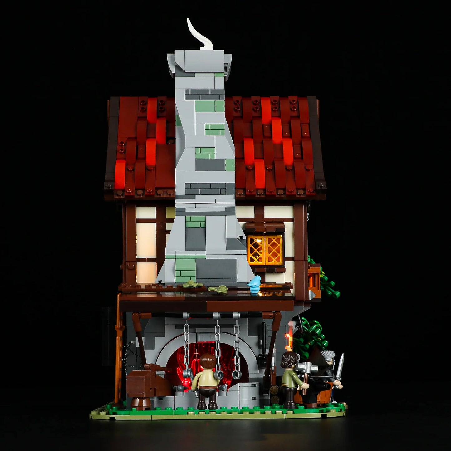 Lumibricks F9040 Forge House rear view with large stone chimney, glowing forge, blacksmith minifigures, and detailed workshop