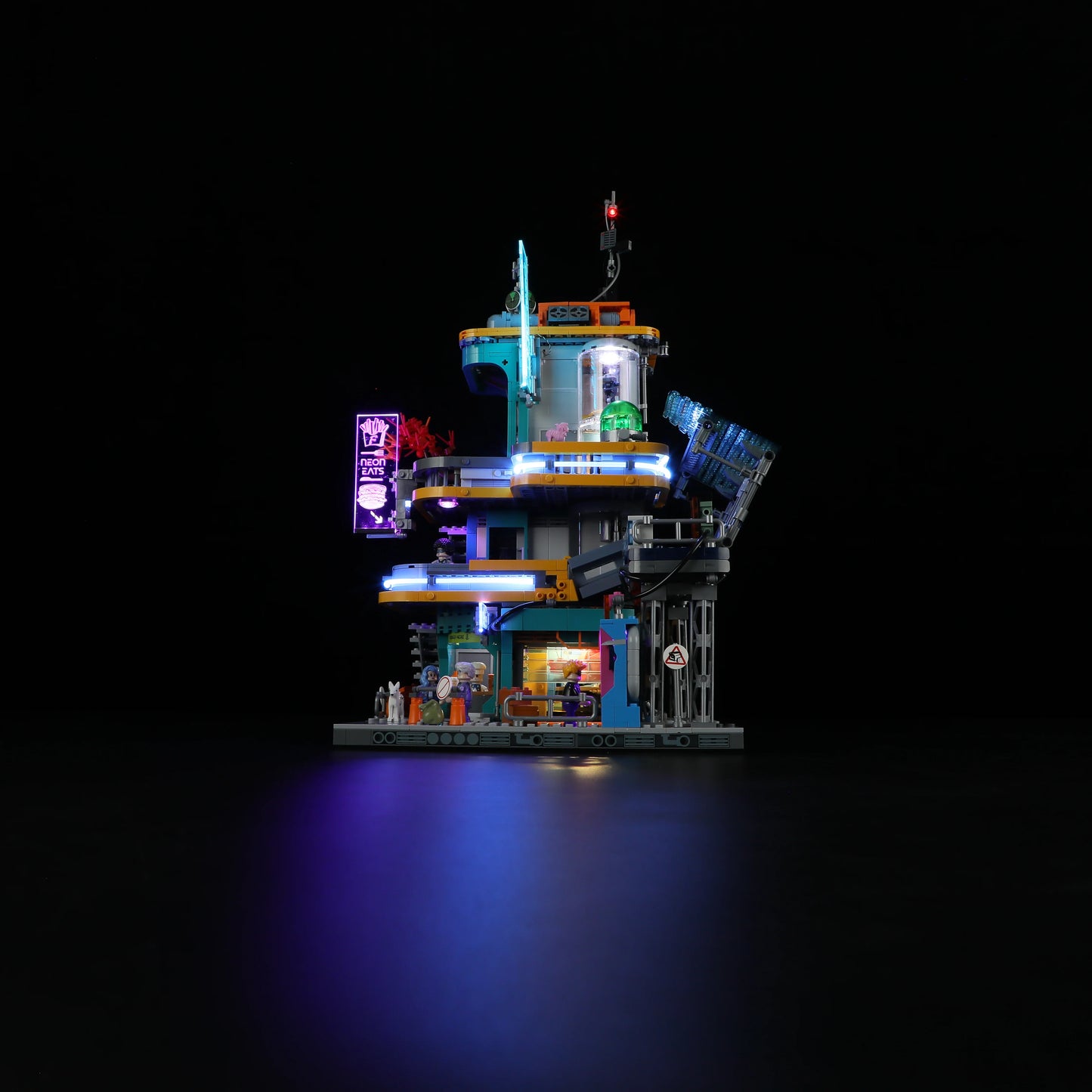 Lumibricks (Formerly Funwhole) F9042 Cyberpunk Apartment side view at night with neon signs, illuminated windows, and minifigures