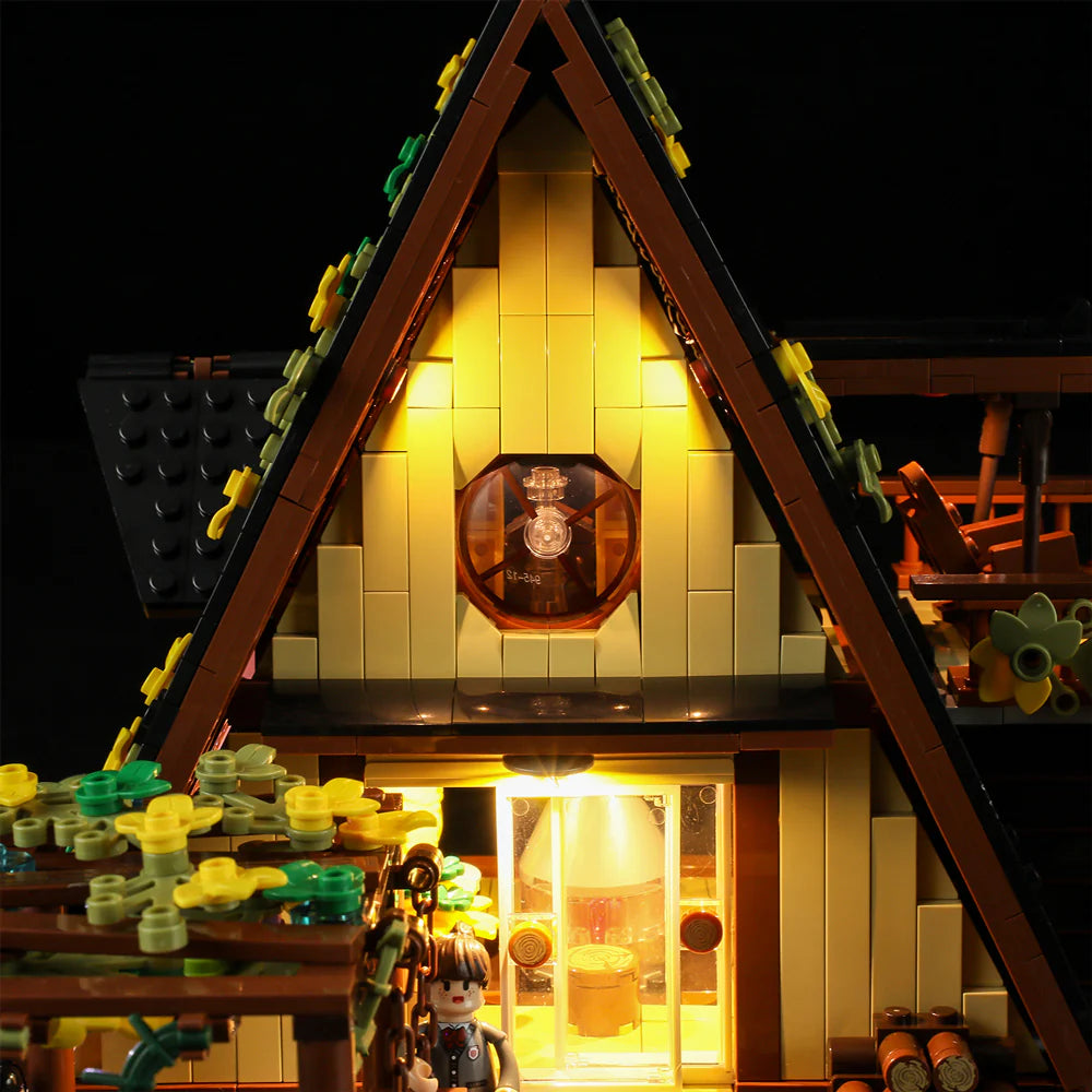 Funwhole A-Frame Cabin LEGO set with illuminated entrance, cozy design, and intricate details for a realistic cabin experience