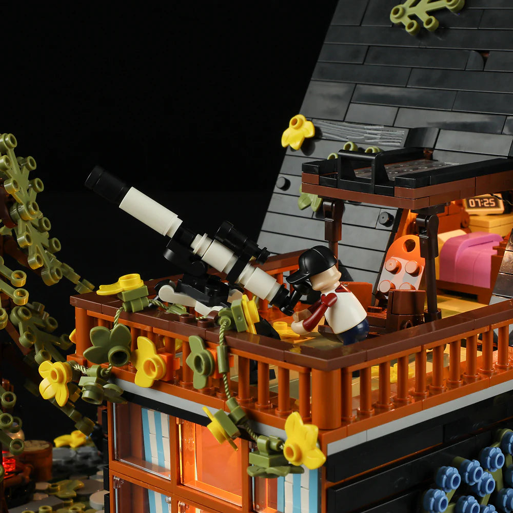 Funwhole A-Frame Cabin LEGO set featuring a stargazing balcony with a telescope for an immersive outdoor adventure experience