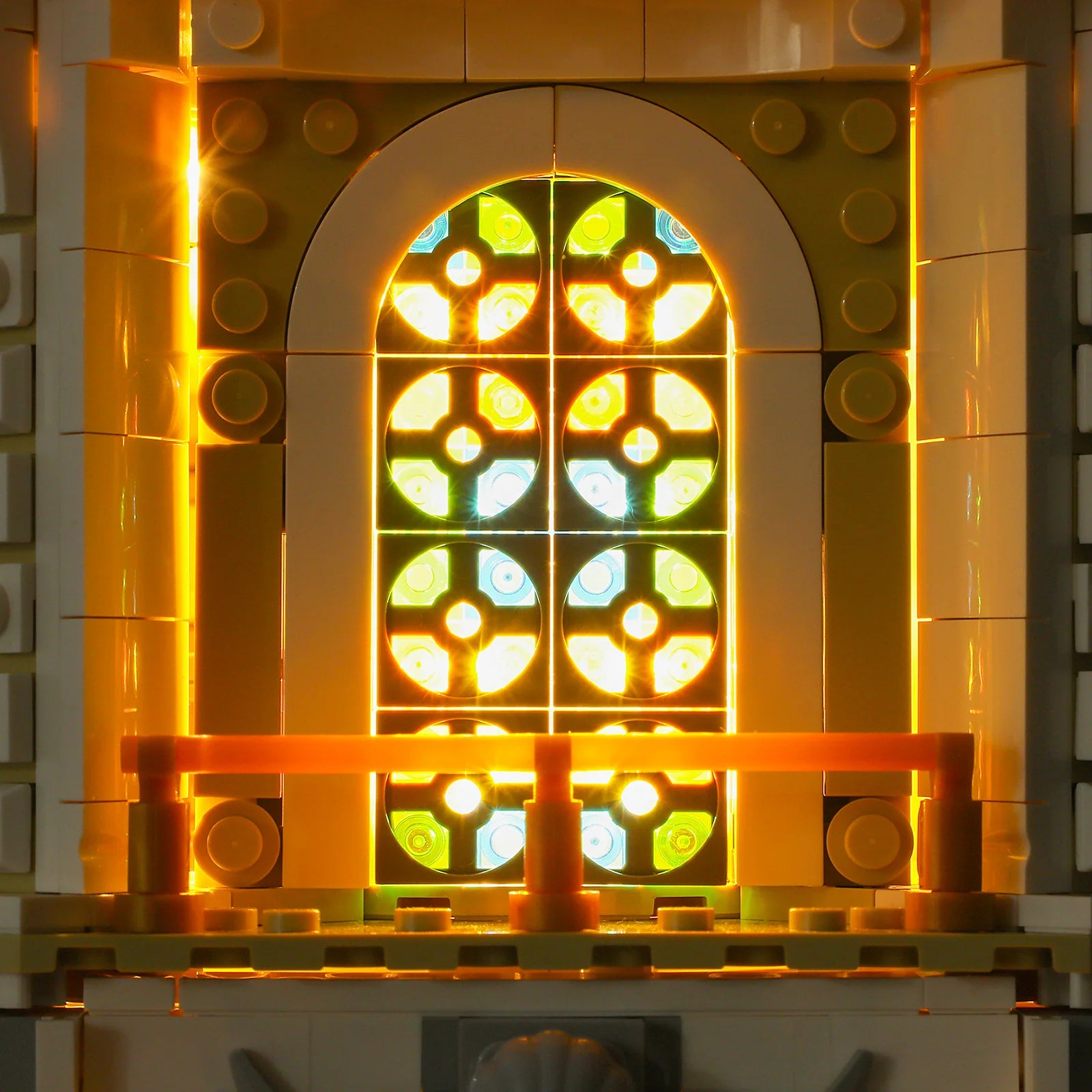 Close-up of Funwhole Antique Store's stained glass window with intricate patterns and warm interior lighting.