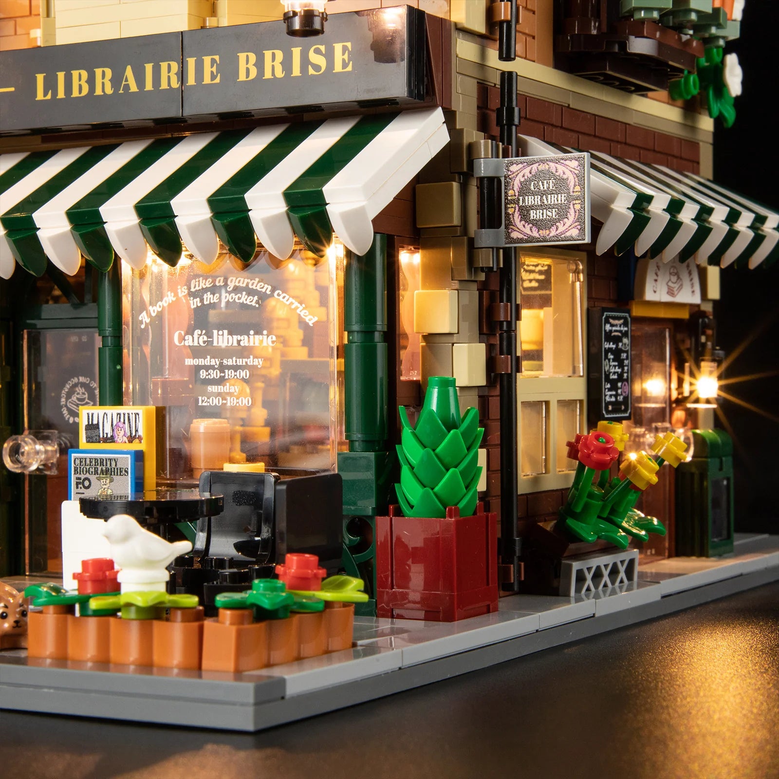 Funwhole Book Cafe exterior with striped awning, glowing lights, a menu sign, and flower decorations, creating a cozy ambiance.