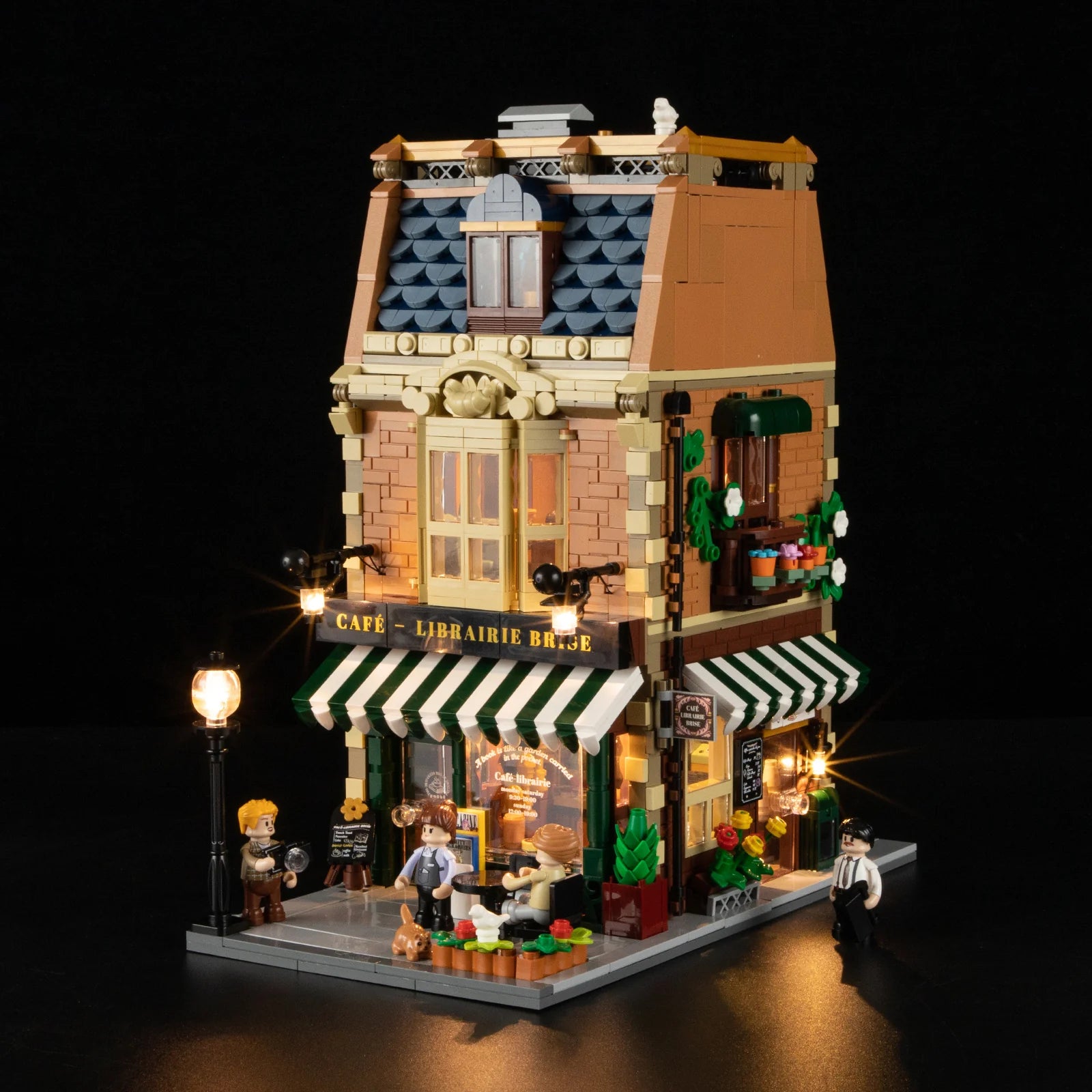 Funwhole Book Cafe building set with warm LED lights, Parisian-style bookstore, coffee shop, and detailed mini-figure scene.