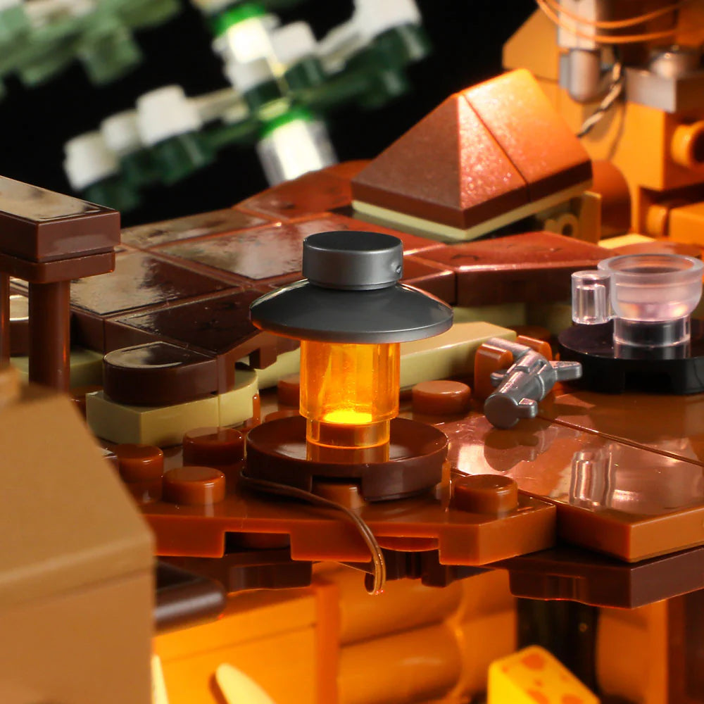 Close-up of Funwhole Hunting Cabin set featuring a glowing lantern on a rustic wooden table, adding cozy ambiance to the scene