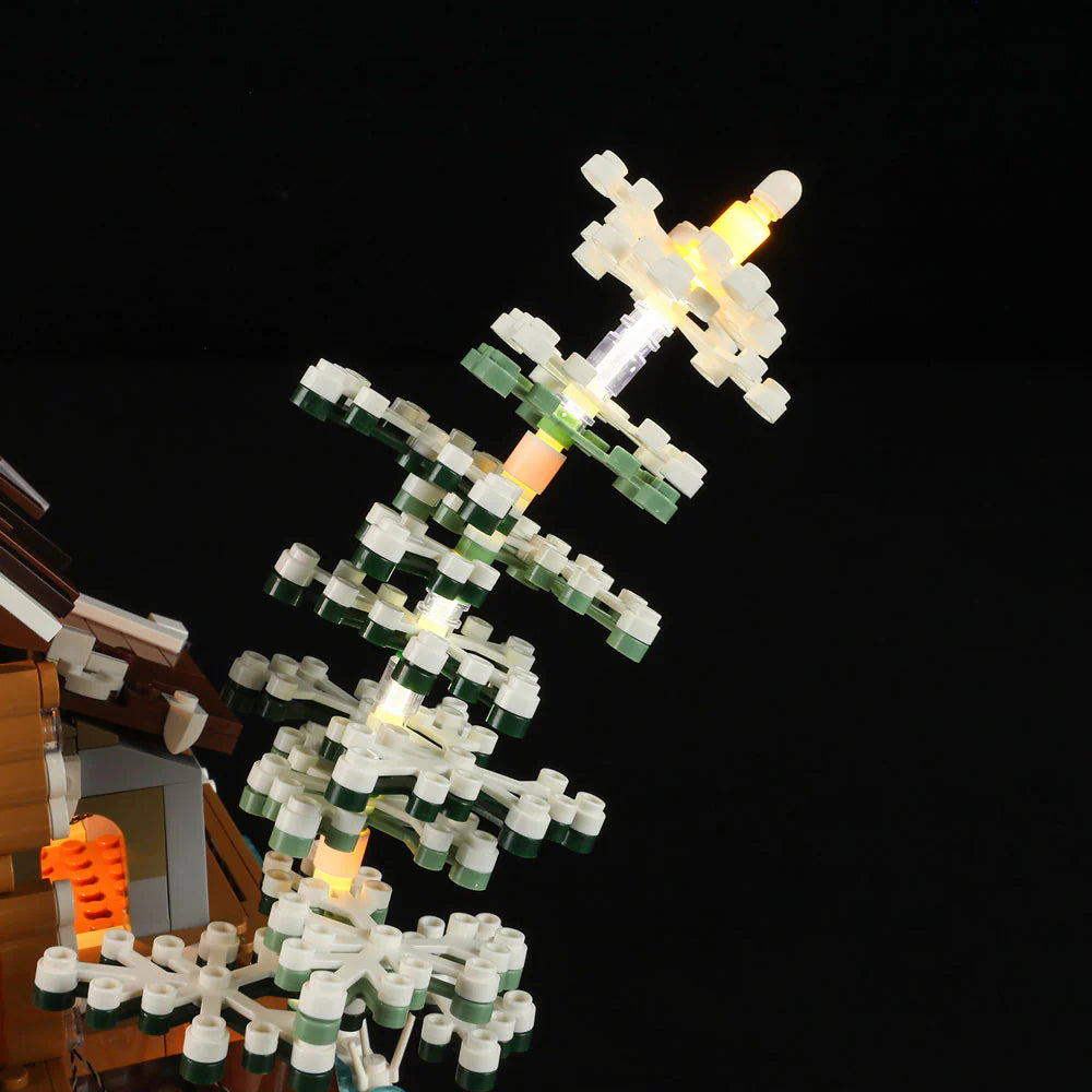 LED-lit snowy tree from Funwhole Hunting Cabin set, showcasing intricate details and realistic winter-themed design