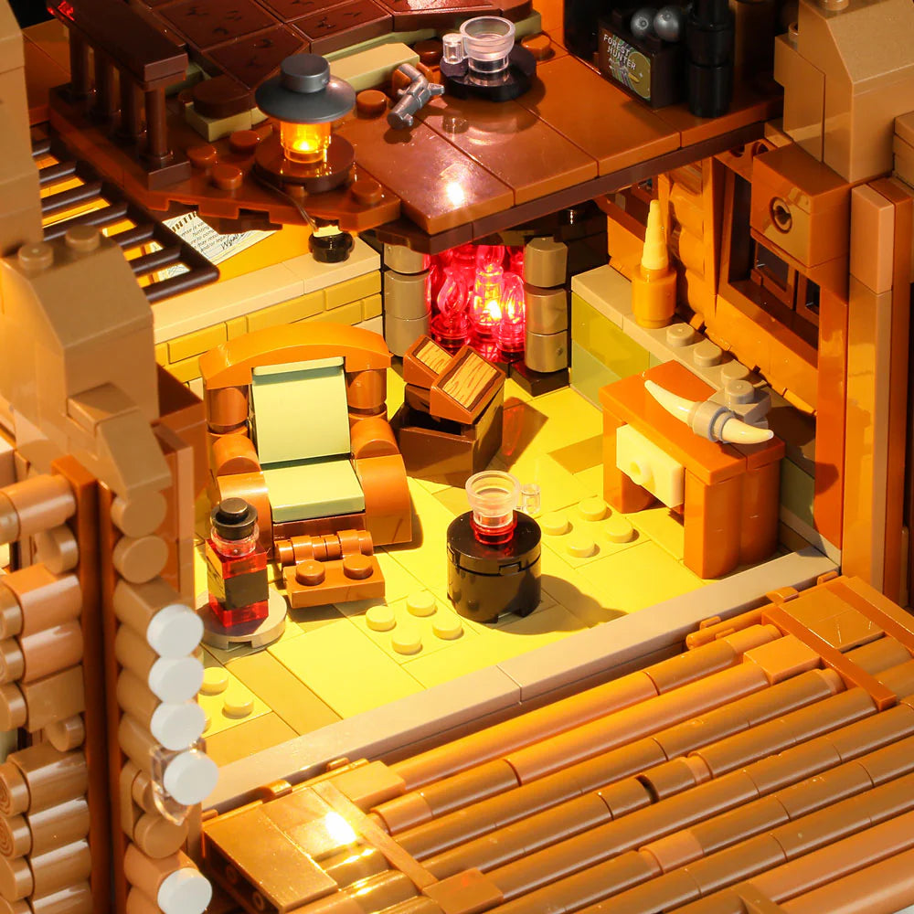 Funwhole Hunting Cabin set featuring a cozy living space with a chair, table, fireplace, and rustic wooden decor for a warm ambiance