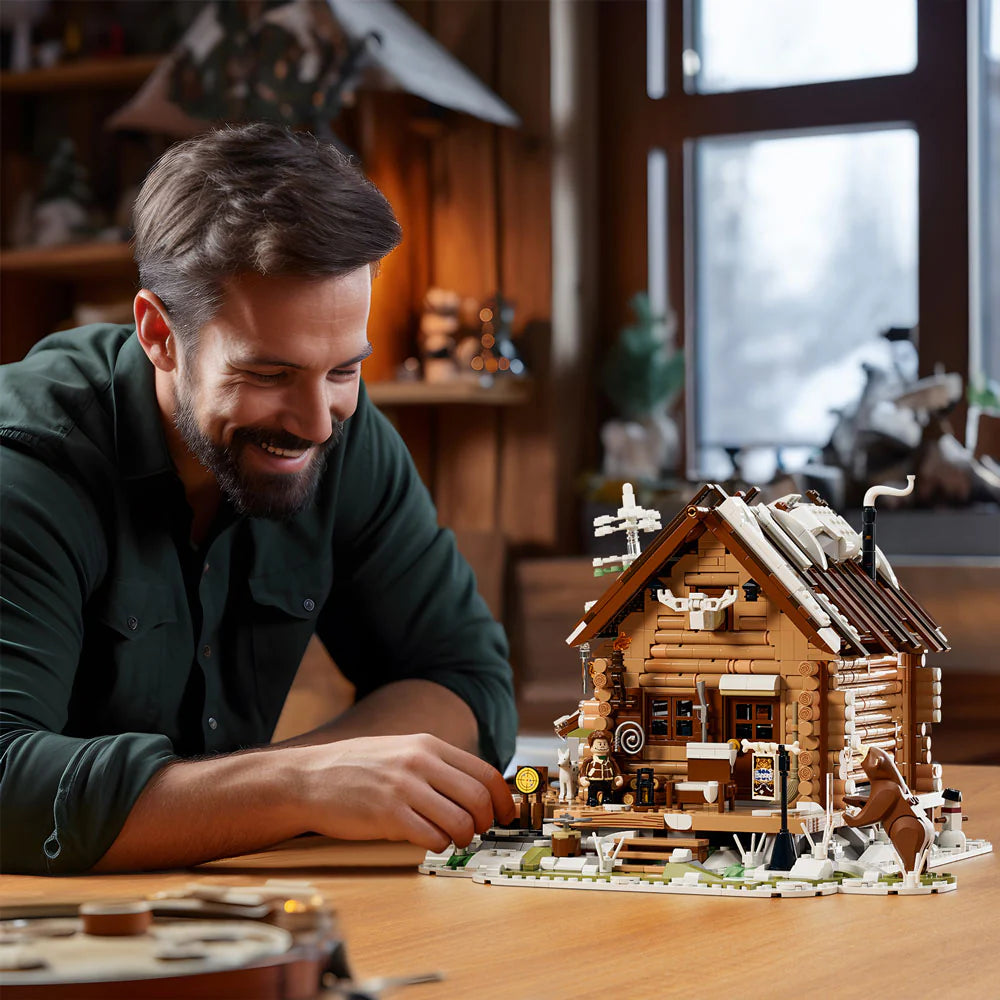 Funwhole Hunting Cabin set featuring a rustic winter lodge, LED lights, and mini-figures, perfect for immersive building fun