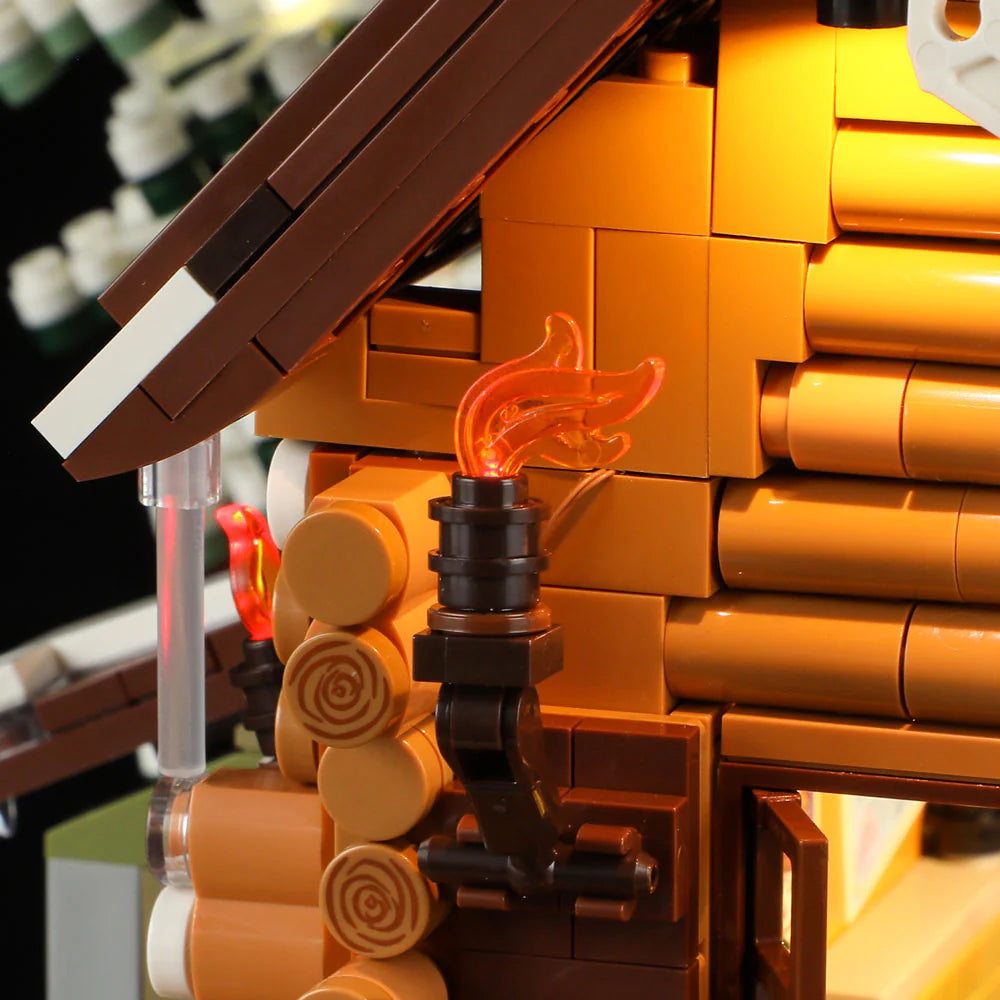 Close-up of a glowing wall torch on the Funwhole Hunting Cabin set, highlighting intricate log cabin details and warm lighting
