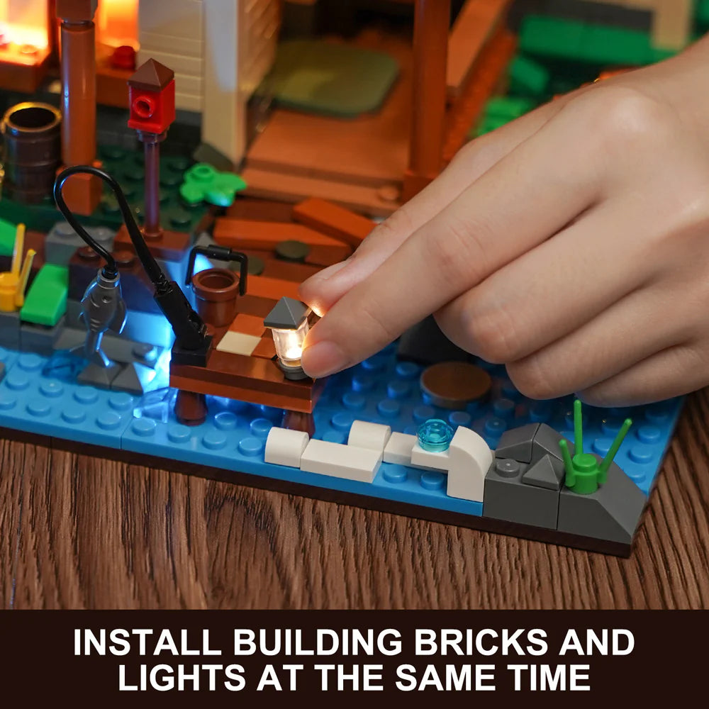 Funwhole Lakeside Lodge set with a hand installing LED lights and bricks simultaneously for an immersive building experience