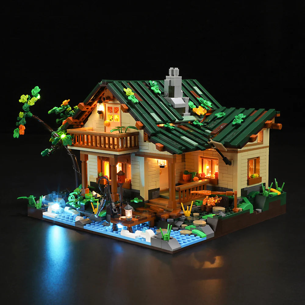 Funwhole Lakeside Lodge set illuminated at night, showcasing its cozy cabin lights and detailed outdoor nature scene