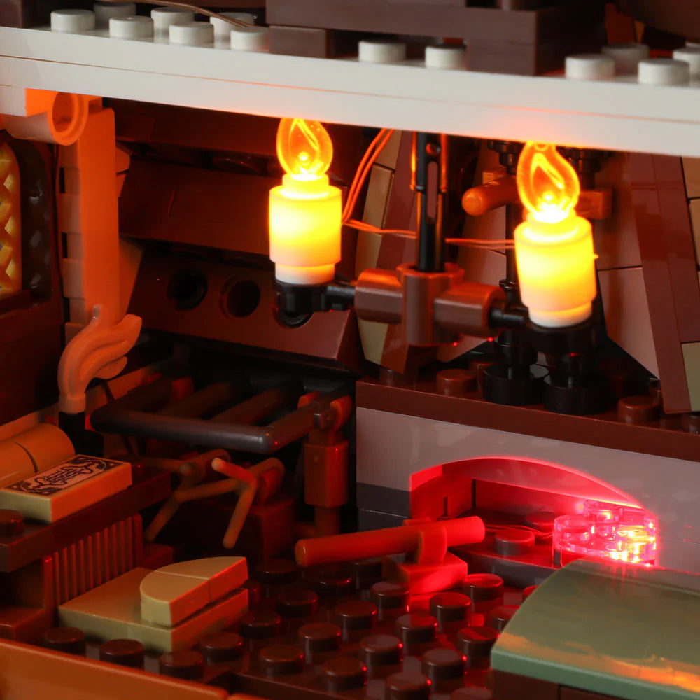 Funwhole Medieval Apothecary Shop Set – Cozy interior with glowing candle chandelier, alchemy forge, and detailed potion tools