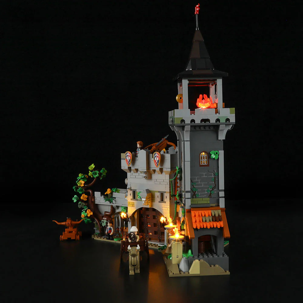 Funwhole Medieval Watchtower Set F9027 – LED-lit watchtower and castle gate with minifigures, cart, and medieval scenery at night