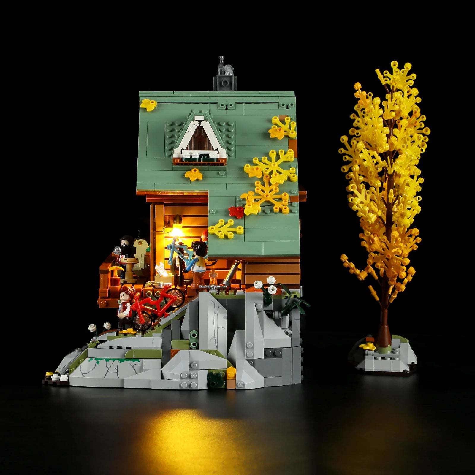 Funwhole Mountain Cabin – Side view of cozy lodge with autumn foliage, LED-lit interior, and outdoor adventure details