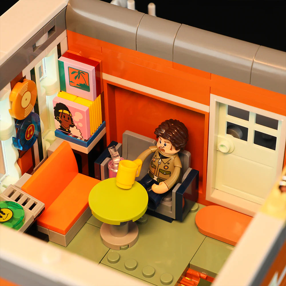 Funwhole Record Store set featuring a cozy lounge area with a minifigure, records, a couch, and a vibrant interior design