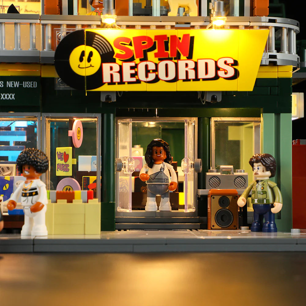 Funwhole Record Store set featuring Spin Records storefront with mini-figures, vinyl display, boombox, and illuminated signage.