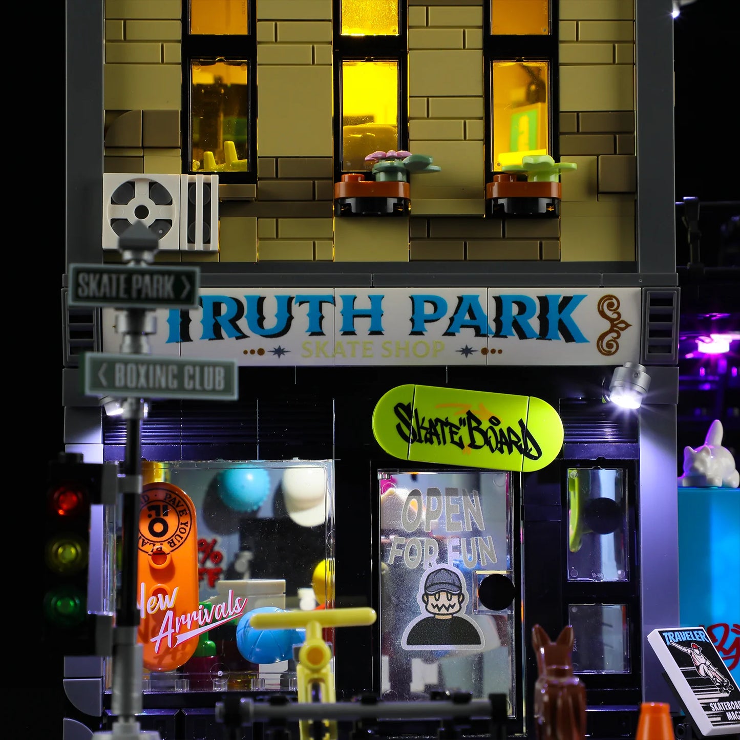 unwhole Skate Shop front view at night with LED lights, skateboard signage, glass storefront, and urban street details