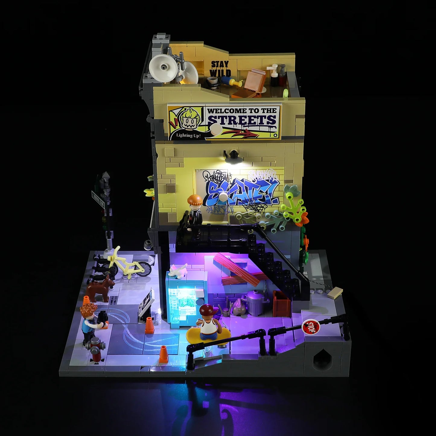 Funwhole Skate Shop set top view at night with LED lights, graffiti, and mini-figures in an urban skate scene