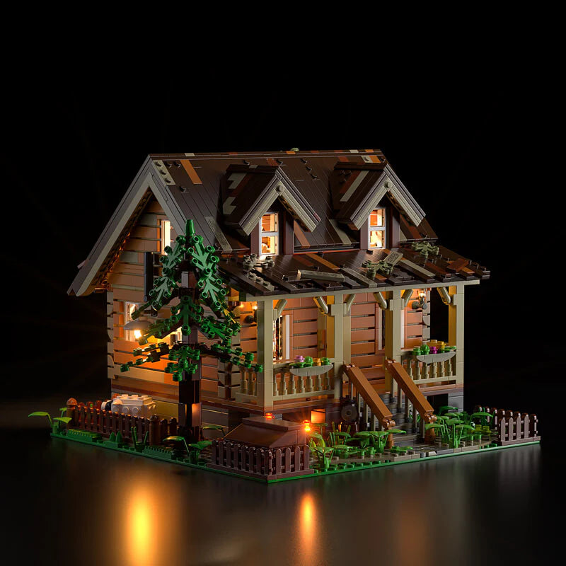 Funwhole Wood Cabin FH9001 with warm LED lights, showcasing a detailed log cabin design with a cozy nighttime glow