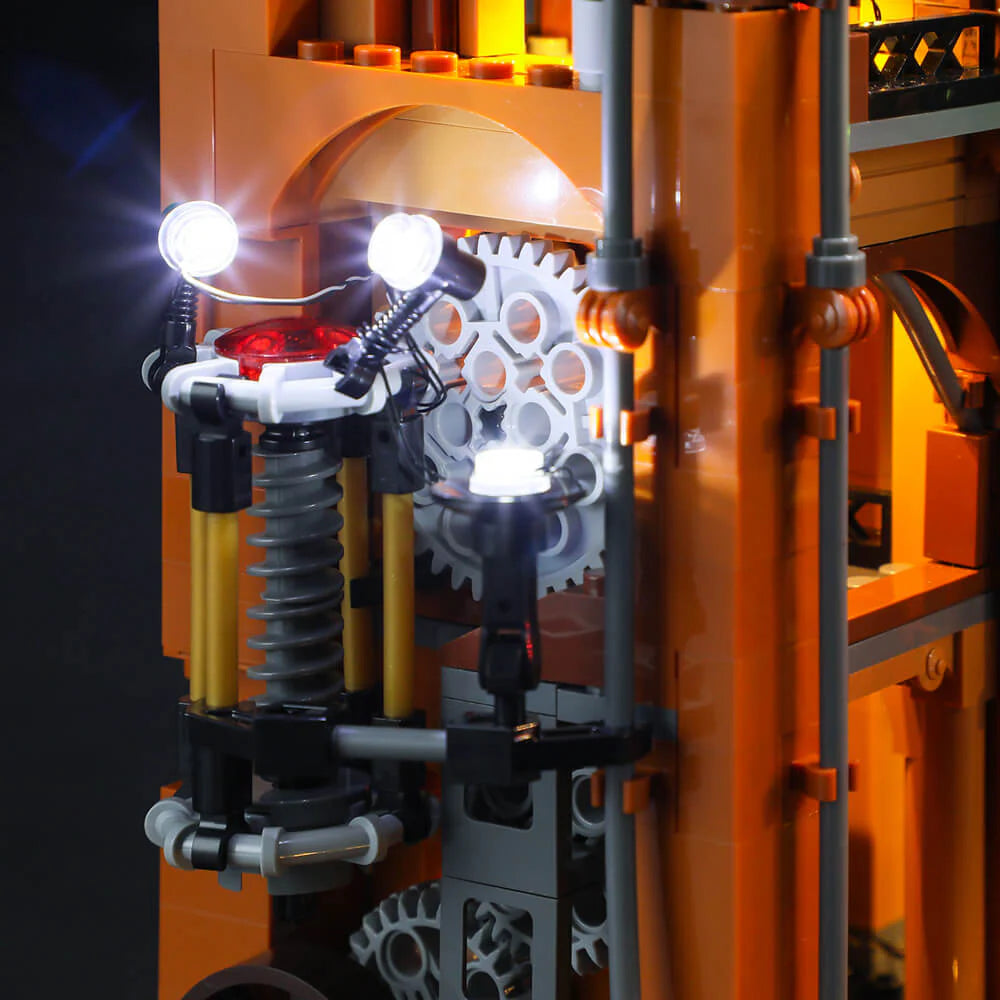 Lumibricks F9007 Steampunk Train Station lamp detail with gears, spring, and glowing LED lights in mechanical assembly