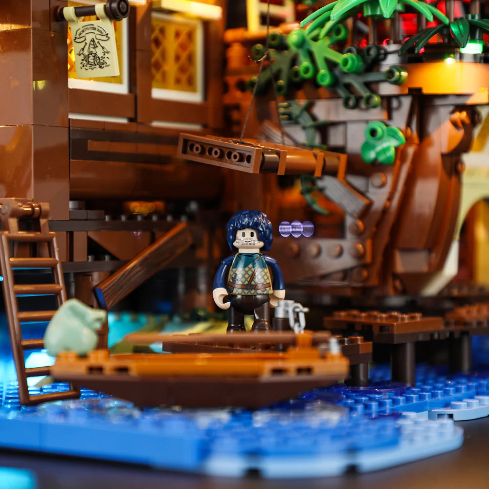 Lumibricks F9011 Medieval Pier Inn close-up of minifigure at dock with rowboat, ladder, and illuminated windows