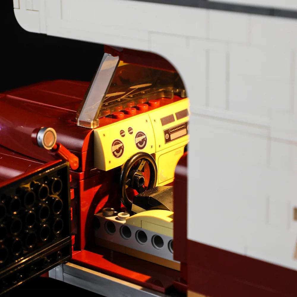 Lumibricks F9012 Camper Van dashboard with steering wheel, instrument panel, and illuminated interior details