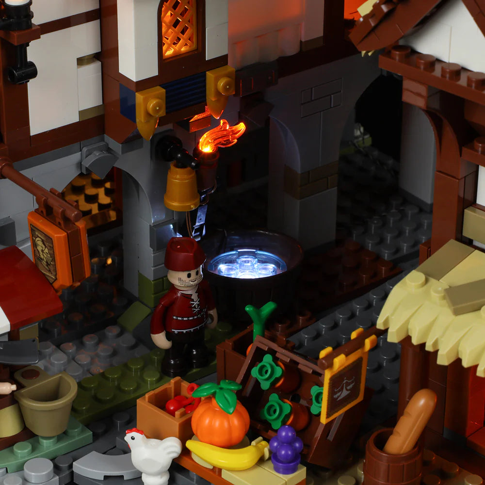 Lumibricks (Formerly Funwhole) F9015 Medieval Market close-up of market well, fruit stand, minifigure, and glowing lanterns