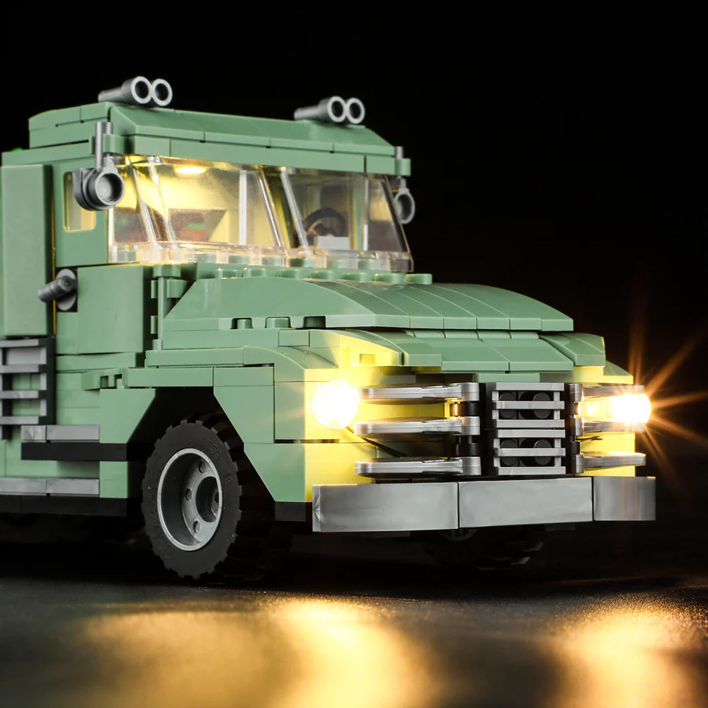 Lumibricks F9016 Farm Truck close-up of front with illuminated LED headlights and detailed grill