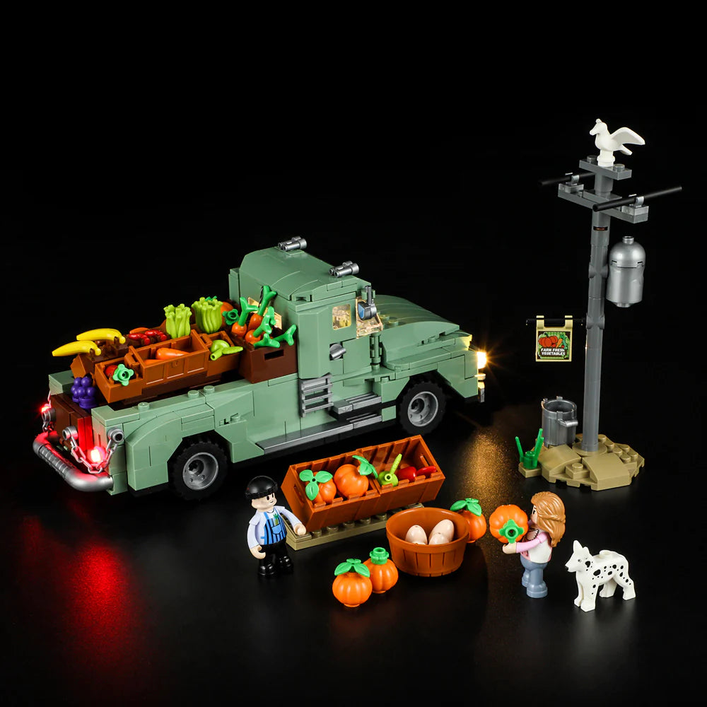 Lumibricks F9016 Farm Truck with market stand, minifigures, dog, pumpkins, eggs, and vegetables at night