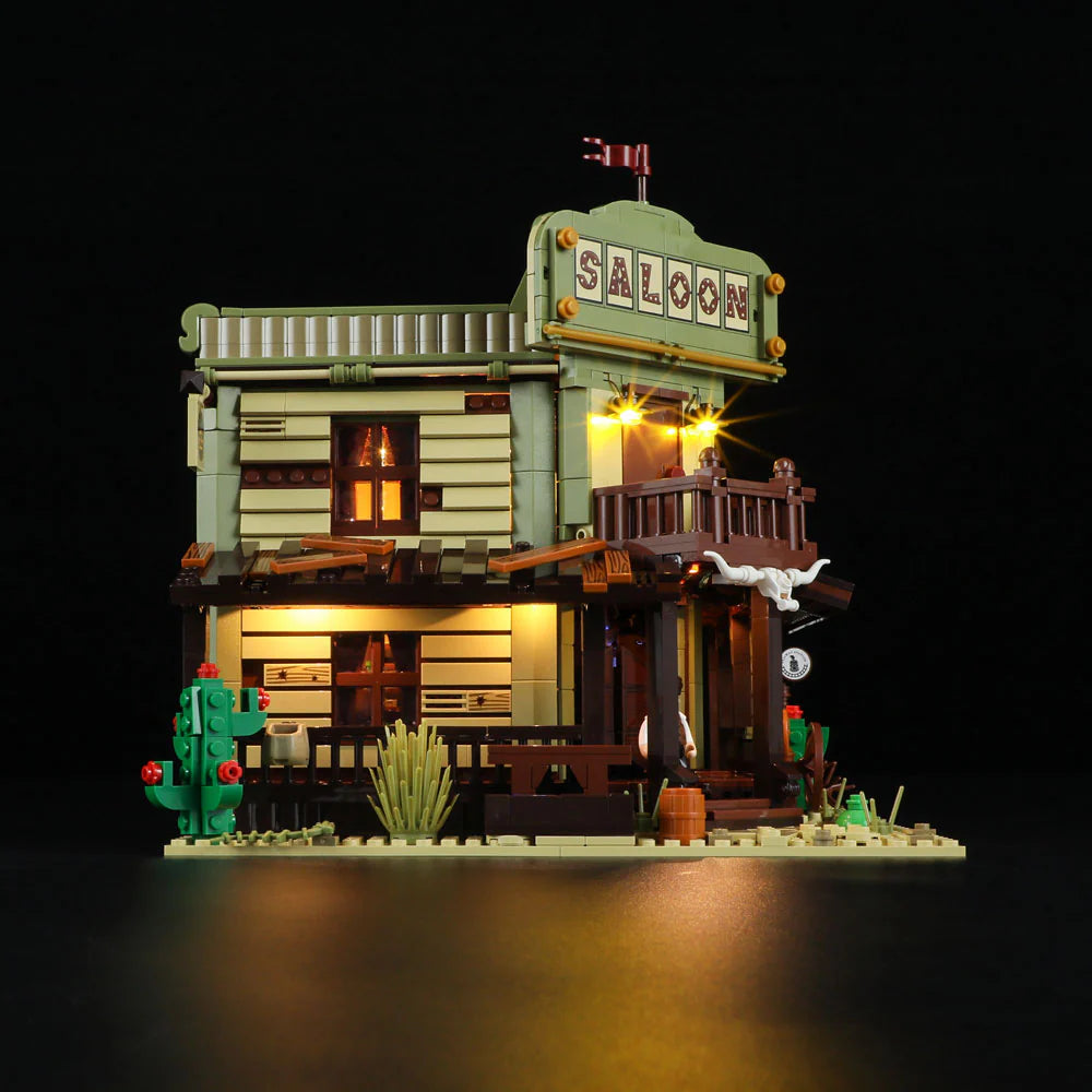 Lumibricks F9021 Western Saloon angled entrance with illuminated balcony, swinging doors, and vintage architectural features