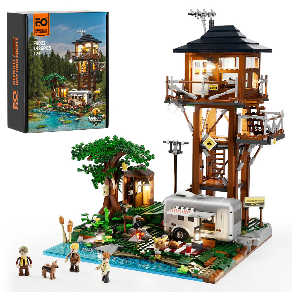 Lumibricks F9022 Lookout Campground set with box, lookout tower, camper trailer, tree, minifigures, and dog on a lakeside scene