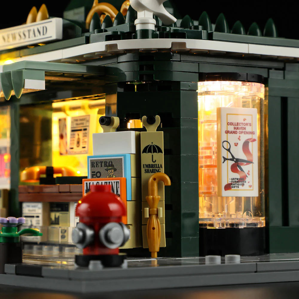 Lumibricks F9023 Newsstand corner with umbrella sharing rack, retro magazine, illuminated poster cylinder, and fire hydrant