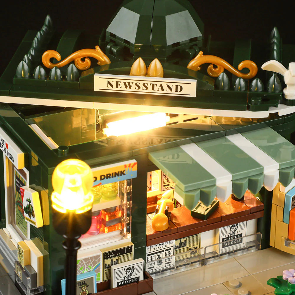 Lumibricks F9023 Newsstand close-up of illuminated interior, striped awning, street lamp, and newsstand sign