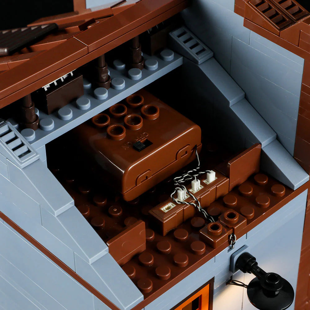 Lumibricks F9026 Sheriff’s Office attic interior showing battery box, wiring, and brown brick-built structure for LED lighting