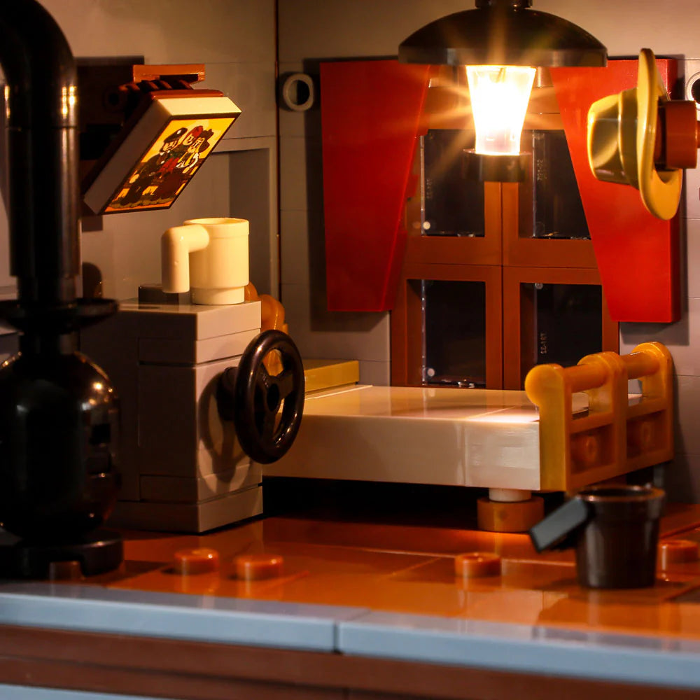 Lumibricks F9026 Sheriff’s Office bedroom with bed, wood stove, mug, sheriff hat, and illuminated hanging lamp at night