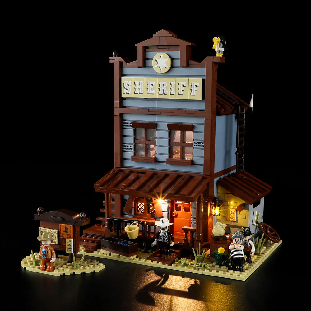 Lumibricks F9026 Sheriff’s Office front view at night with glowing lights, sheriff sign, and minifigures in Western scene