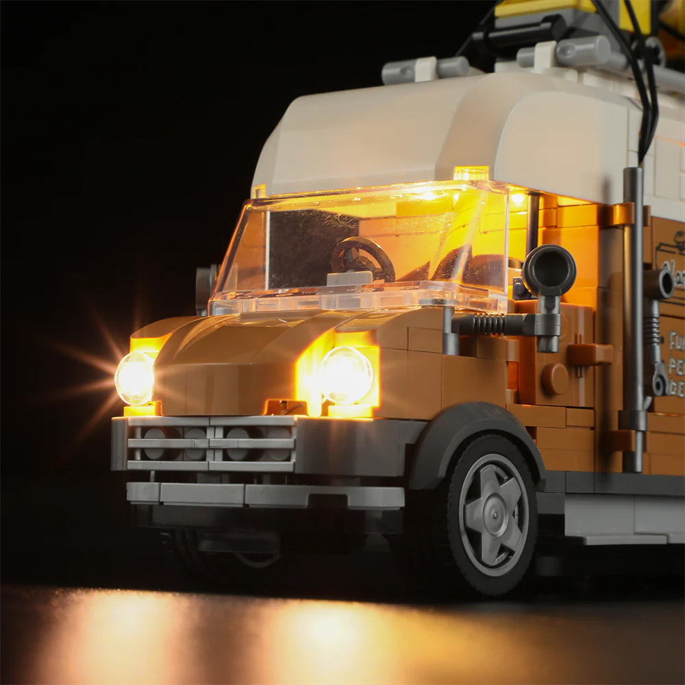Lumibricks F9030 Carpentry Van front view at night with bright LED headlights, windshield, and detailed bumper